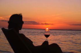 Sunset with wine, Ambergris Caye, Belize – Best Places In The World To Retire – International Living